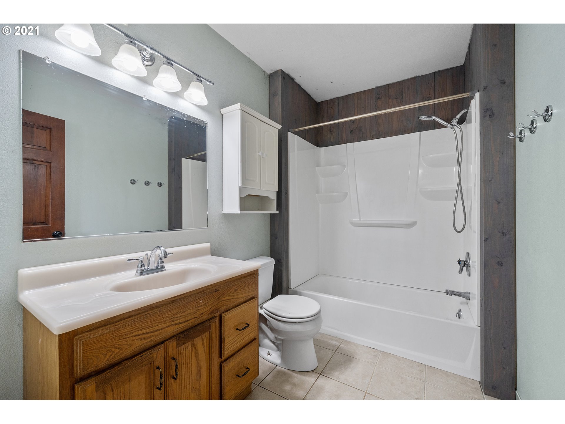 1915 Tone Road Tillamook, OR 97141 - Photo 8 of 24 a bathroom with a sink toilet double vanity and shower