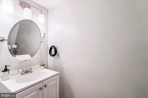 a bathroom with a sink and mirror