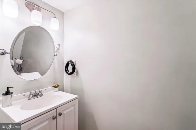 a bathroom with a sink and mirror