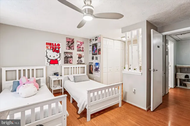 a bedroom with furniture and a chandelier