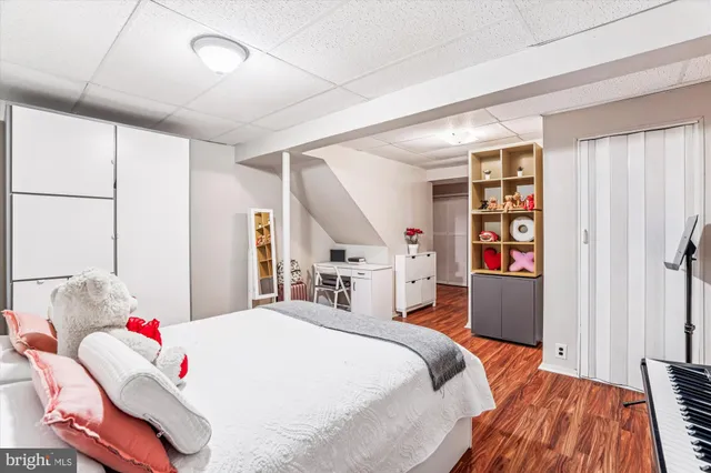 a bed room with a bed and a book shelf