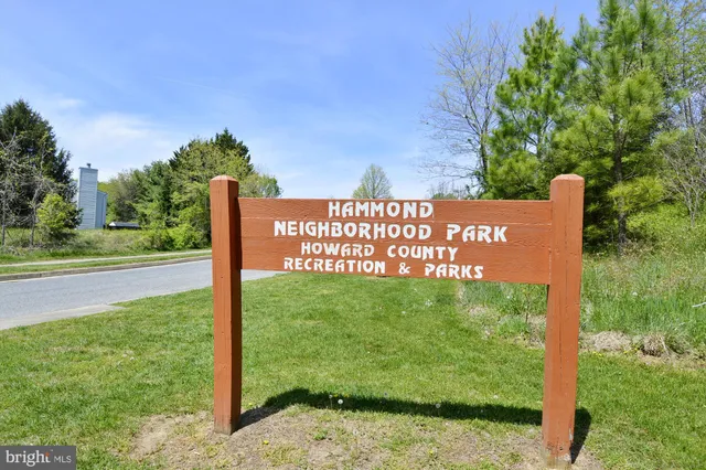 a view of a sign board with yard