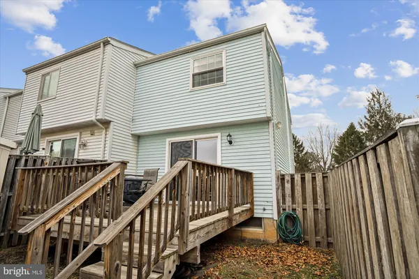 a view of wooden house with a deck