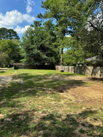 a view of a water fountain and a big yard