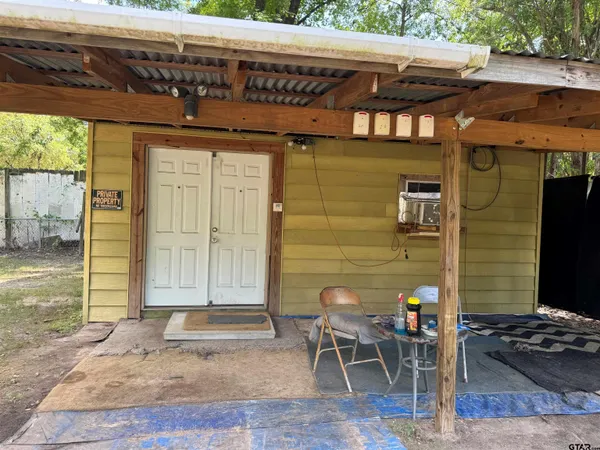 a front view of a house with a patio