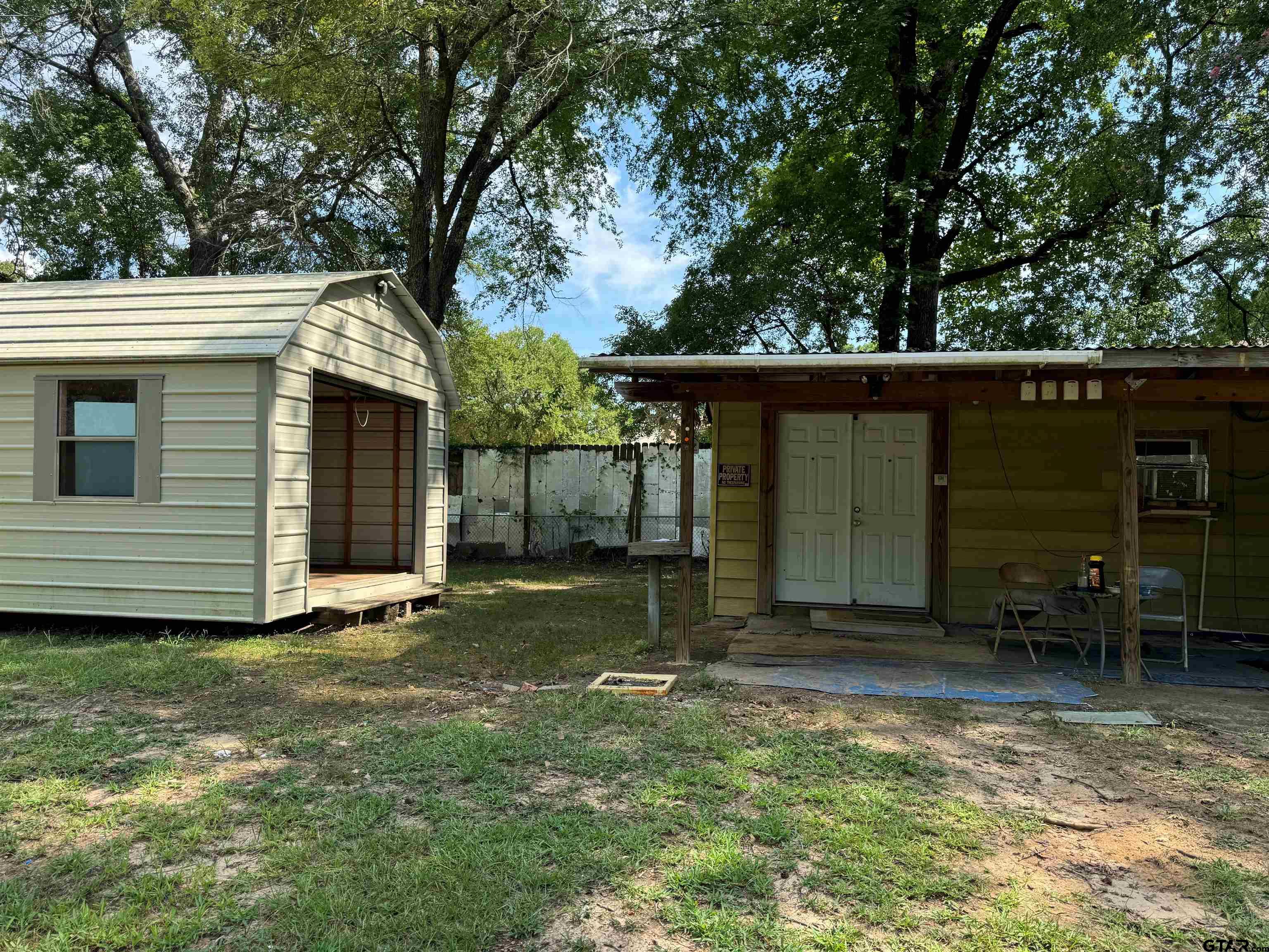 212 East Pirate Street Longview, TX 75604 - Photo 8 of 12 a view of a house with a yard