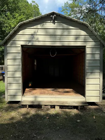 a view of backyard with a small cabin