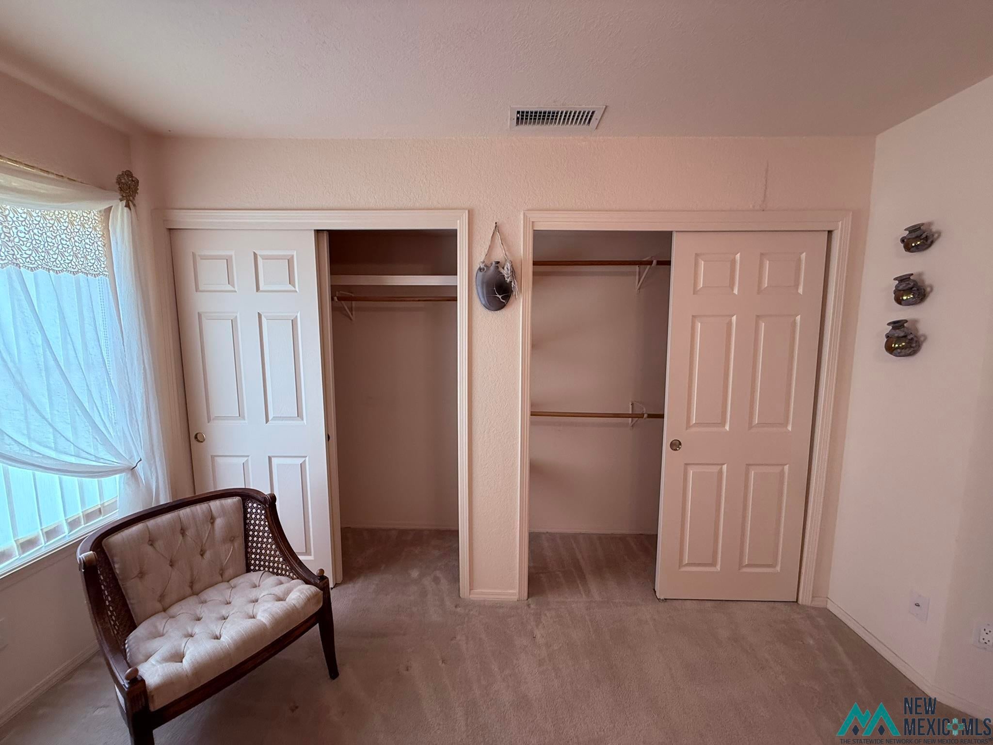 300 Rio Grande Circle Elephant Butte, NM 87935 - Photo 21 of 99 Wall-to-wall carpeting and two built-in closet spaces with sliding doors