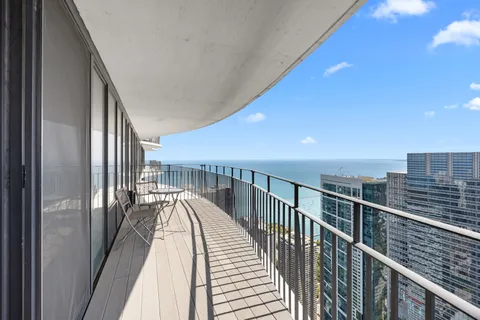 a view of a balcony with wooden floor