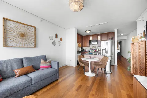 a kitchen with stainless steel appliances granite countertop a refrigerator sink and microwave