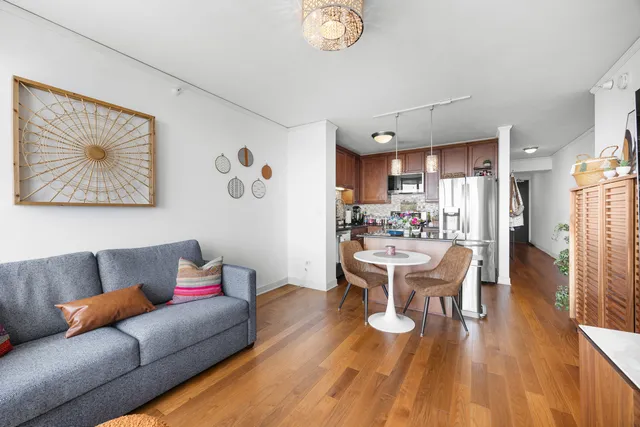 a kitchen with stainless steel appliances granite countertop a refrigerator sink and microwave