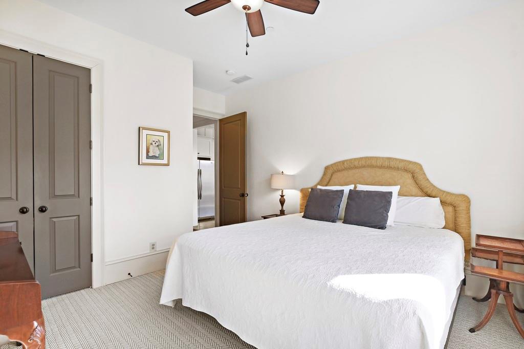 402 Prosper Circle, Unit 102 Marietta, GA 30060 - Photo 12 of 72 a bedroom with a bed and dresser