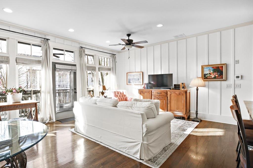 402 Prosper Circle, Unit 102 Marietta, GA 30060 - Photo 17 of 72 a living room with furniture a flat screen tv and a large window
