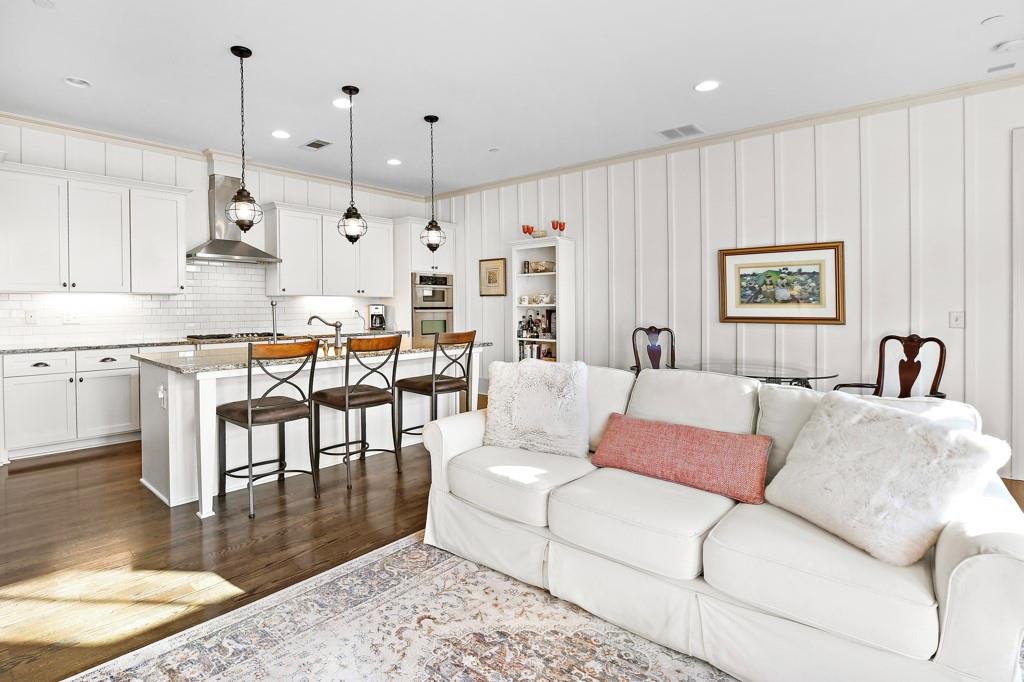 402 Prosper Circle, Unit 102 Marietta, GA 30060 - Photo 19 of 72 a living room with furniture kitchen view and a chandelier