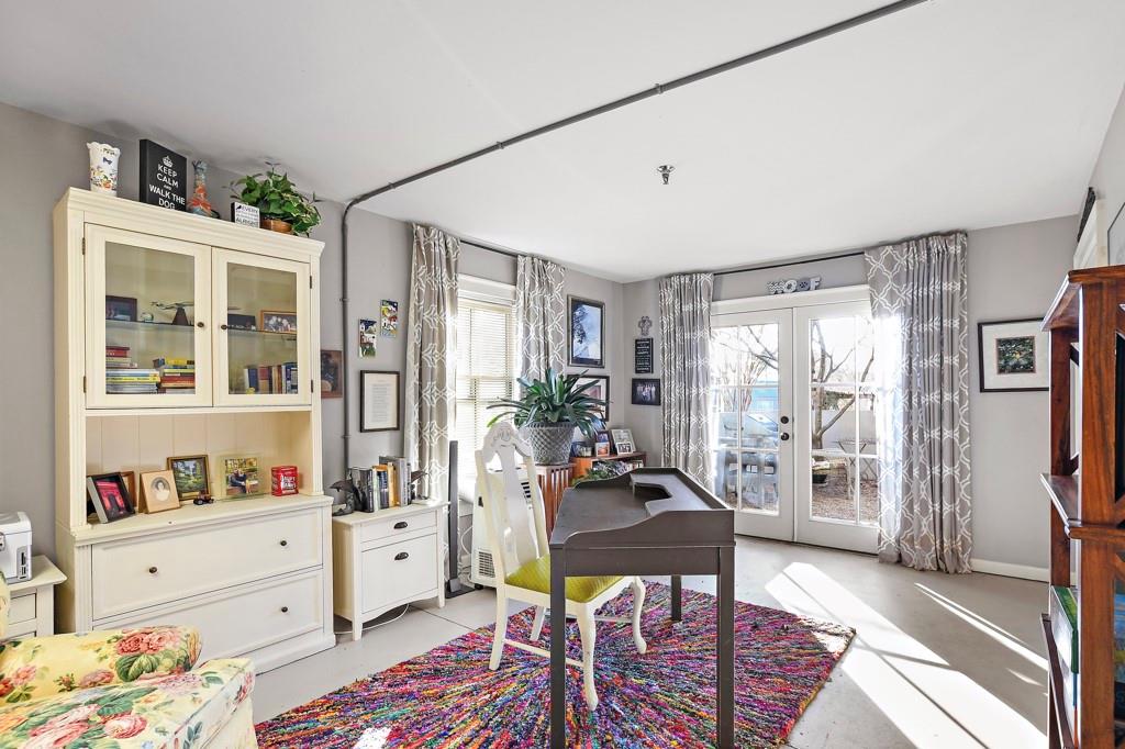 402 Prosper Circle, Unit 102 Marietta, GA 30060 - Photo 28 of 72 a living room with furniture and a window