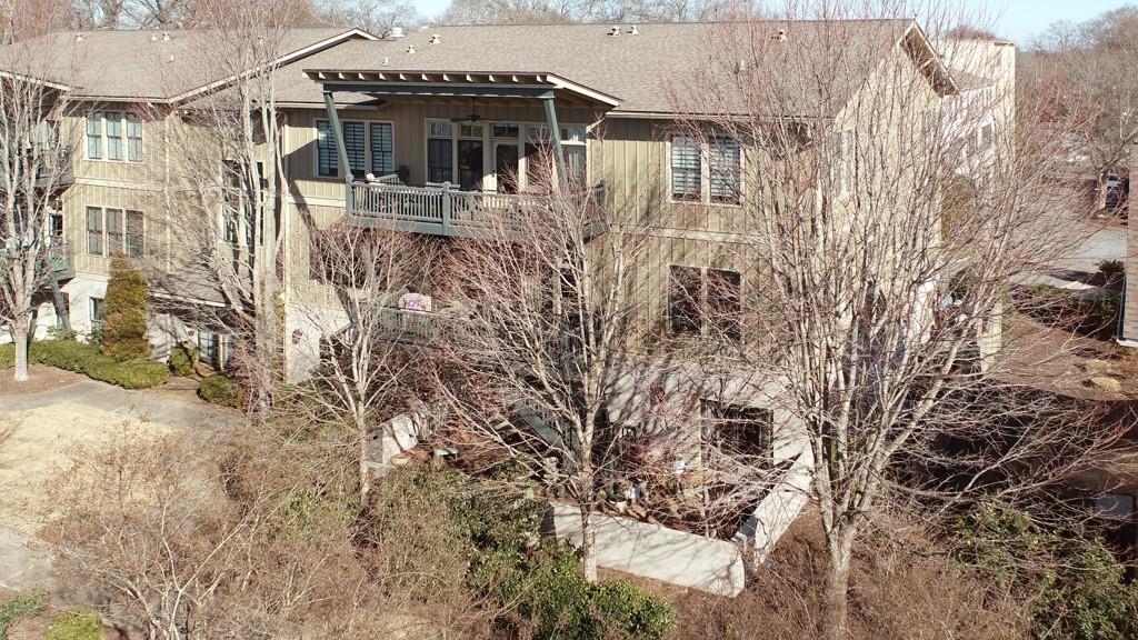 402 Prosper Circle, Unit 102 Marietta, GA 30060 - Photo 41 of 72 a view of a house with a yard