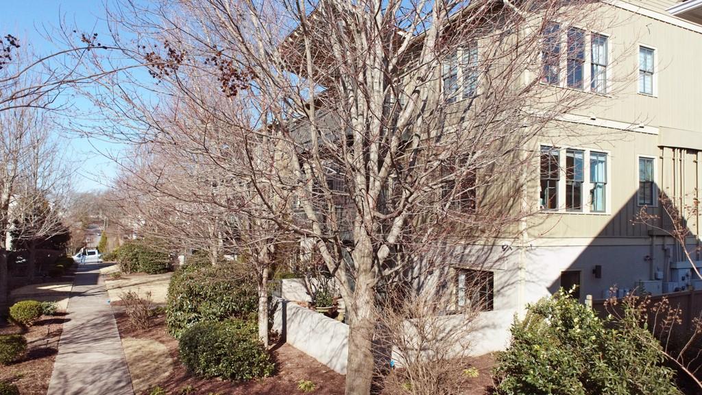 402 Prosper Circle, Unit 102 Marietta, GA 30060 - Photo 50 of 72 a view of a house with a yard