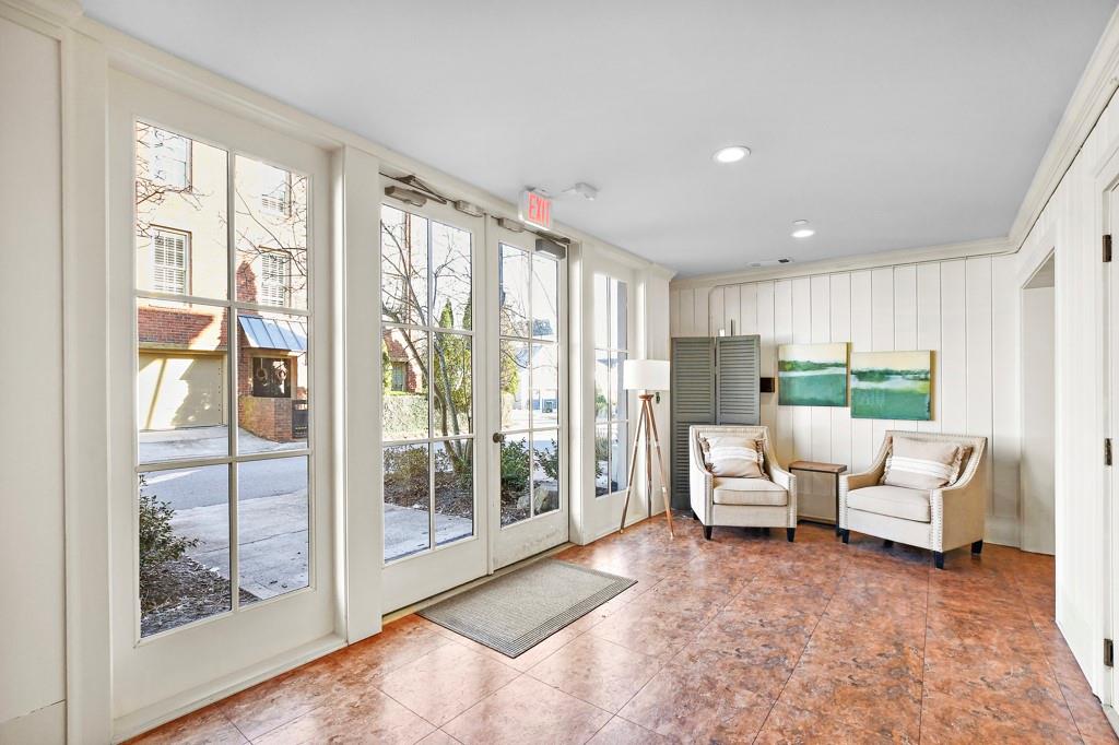 402 Prosper Circle, Unit 102 Marietta, GA 30060 - Photo 6 of 72 a living room with furniture and a large window