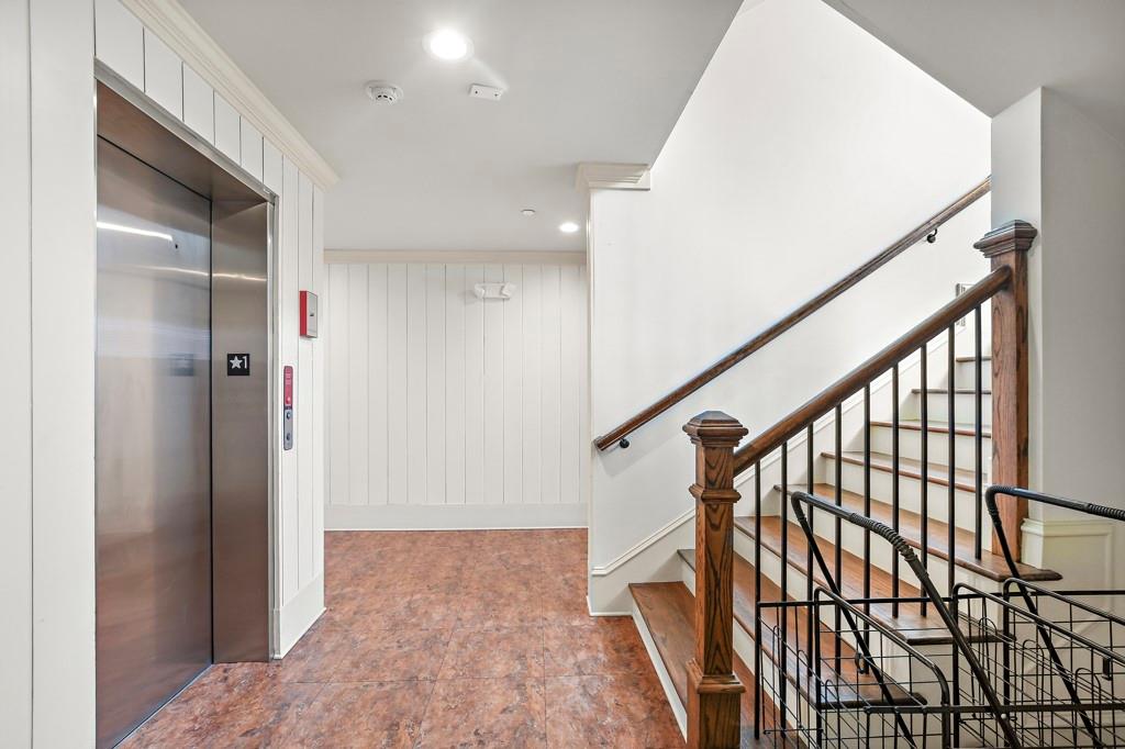 402 Prosper Circle, Unit 102 Marietta, GA 30060 - Photo 7 of 72 a view of staircase with wooden floor and stairs