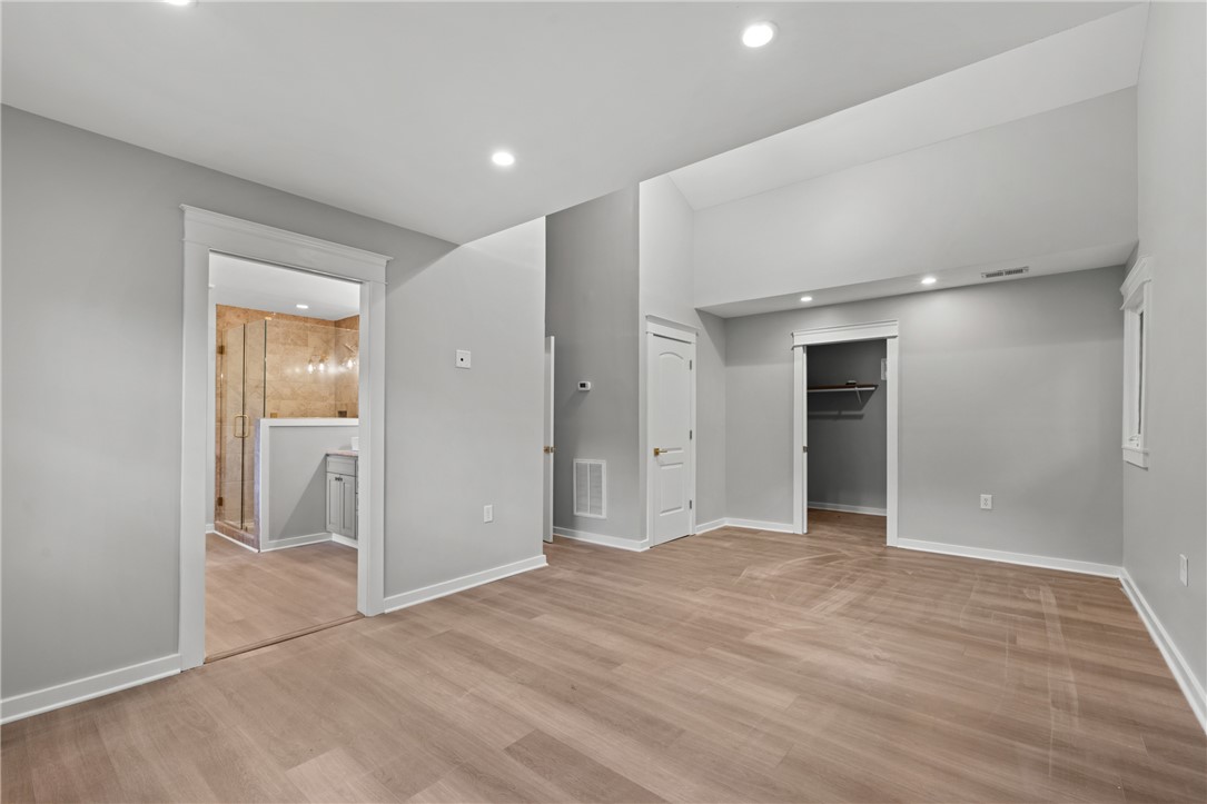 309 Woodland Way Clemson, SC 29631 - Photo 22 of 43 This primary bedroom features high ceilings and direct access to a private bathroom.