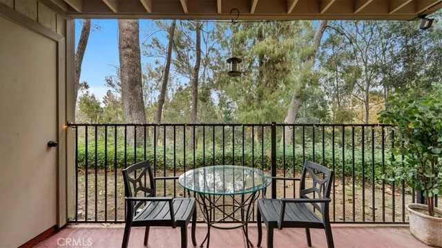 a view of a balcony with furniture and a window