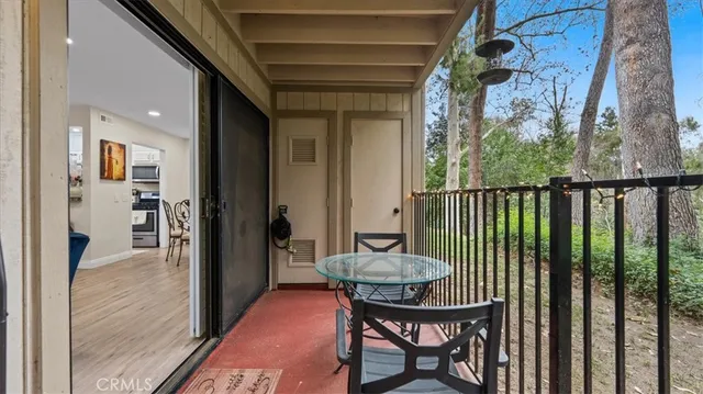 a view of a balcony with furniture
