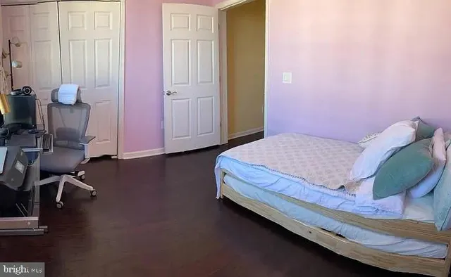 a bedroom with a bed and chair