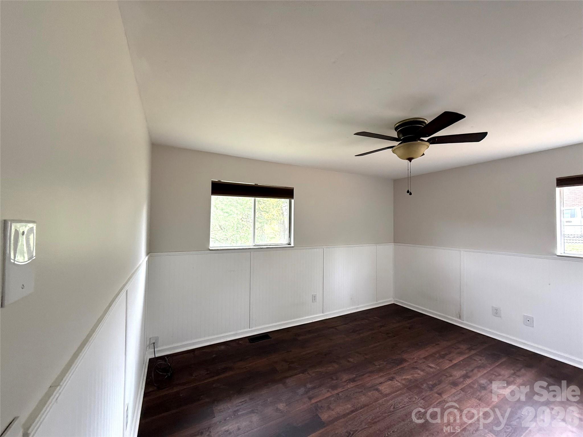 18 Briar Fork Way, Unit 4 Fletcher, NC 28732 - Photo 14 of 36 an empty room with wooden floor and windows