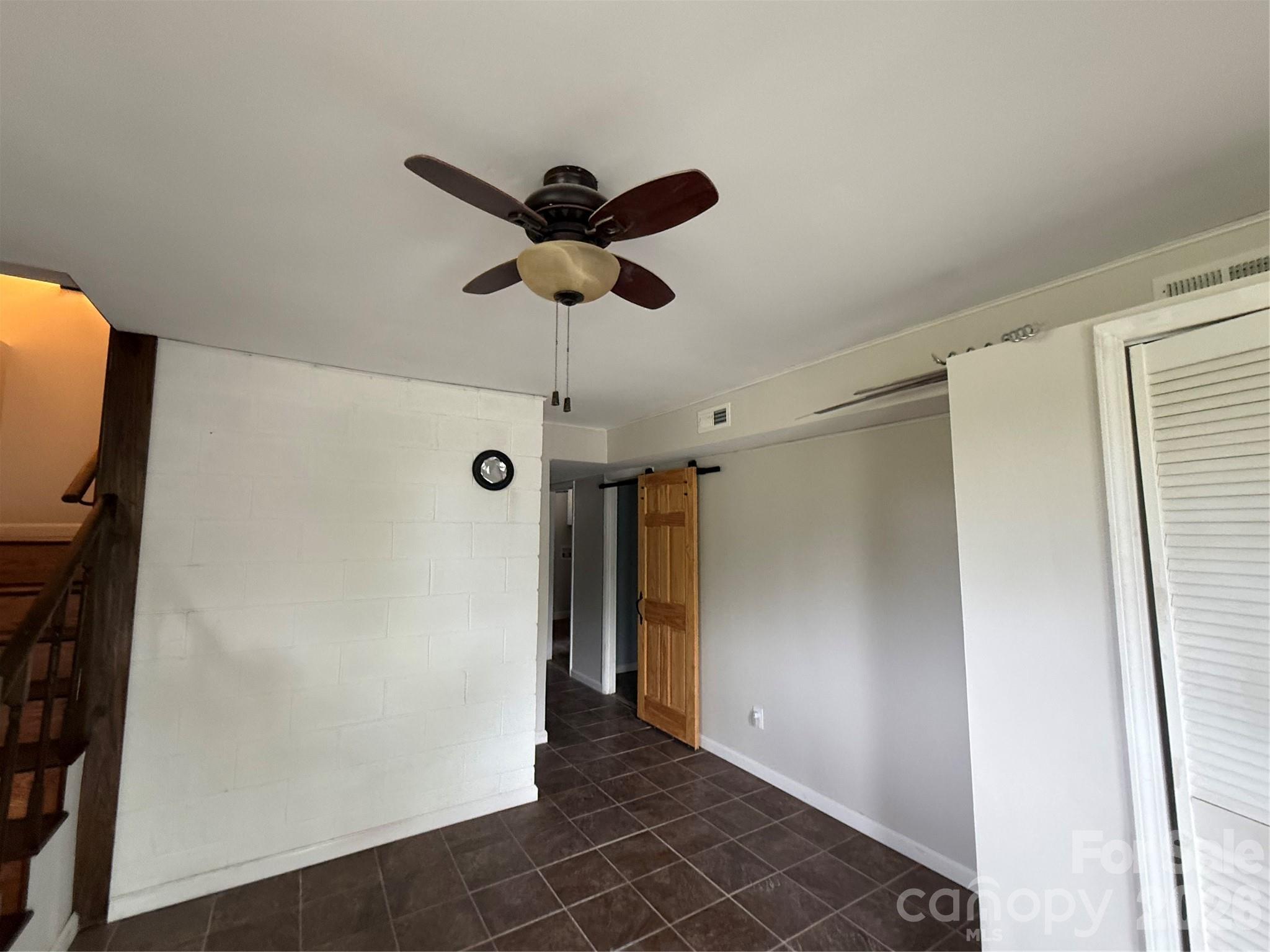 18 Briar Fork Way, Unit 4 Fletcher, NC 28732 - Photo 16 of 36 a view of a hallway with a refrigerator
