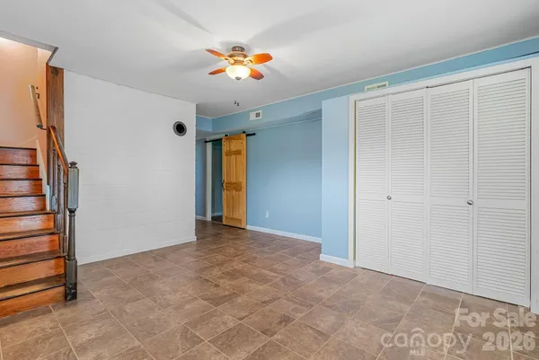 a view of an empty room with a window
