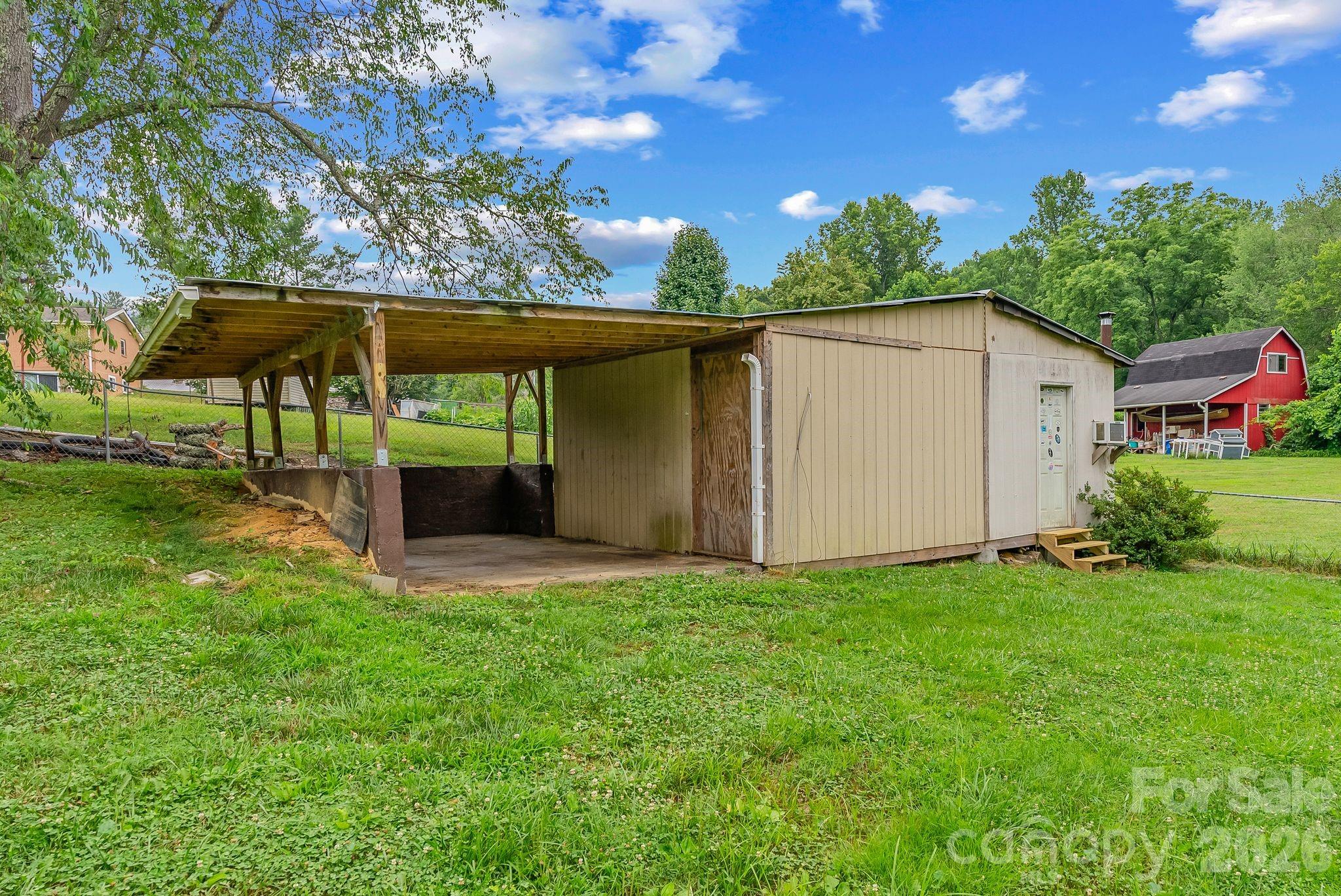 18 Briar Fork Way, Unit 4 Fletcher, NC 28732 - Photo 28 of 36 a view of a house with backyard and garden