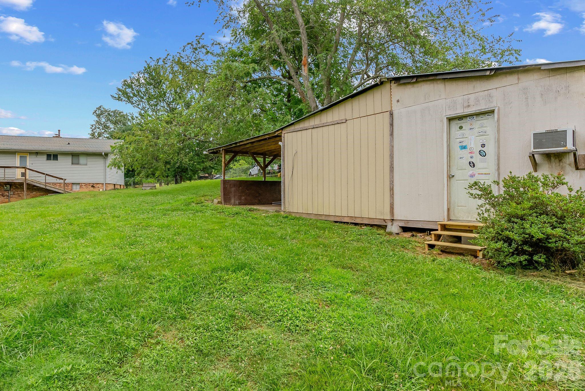 18 Briar Fork Way, Unit 4 Fletcher, NC 28732 - Photo 29 of 36 a backyard of a house with lots of green space
