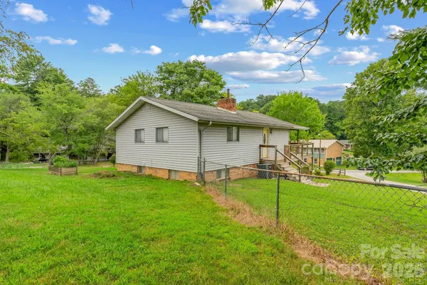a view of a backyard with a garden