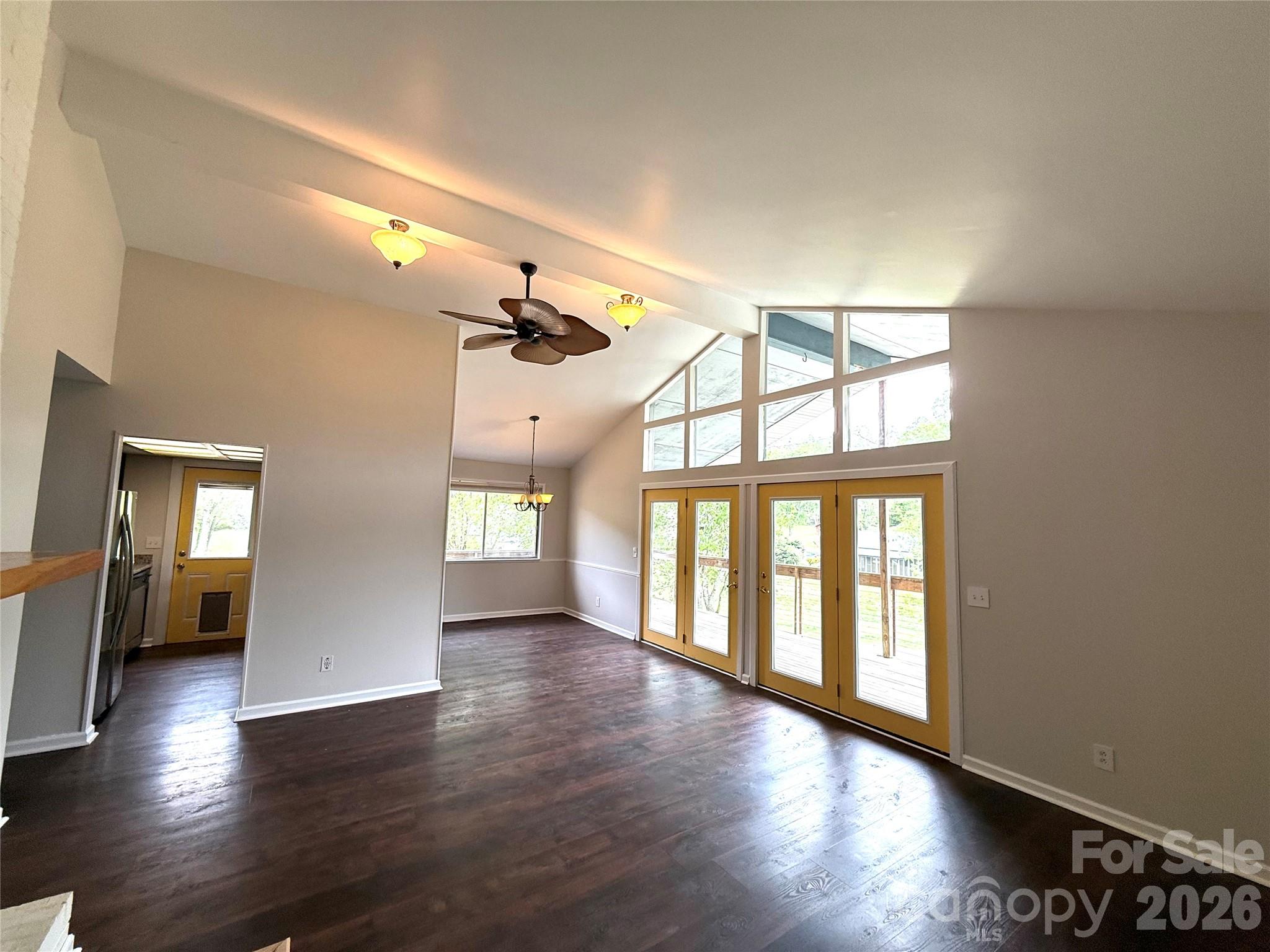 18 Briar Fork Way, Unit 4 Fletcher, NC 28732 - Photo 5 of 36 a view of an empty room with wooden floor and a window