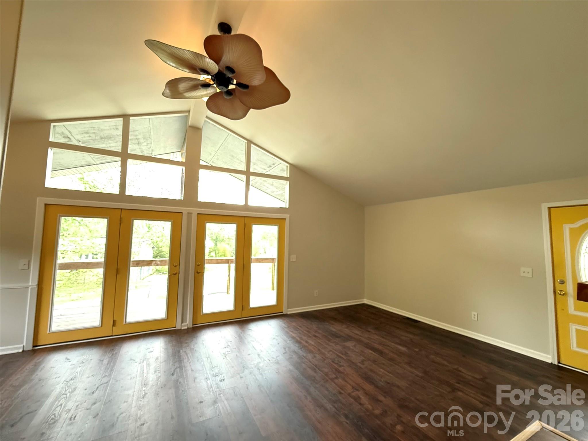 18 Briar Fork Way, Unit 4 Fletcher, NC 28732 - Photo 6 of 36 a view of an empty room with a window and wooden floor