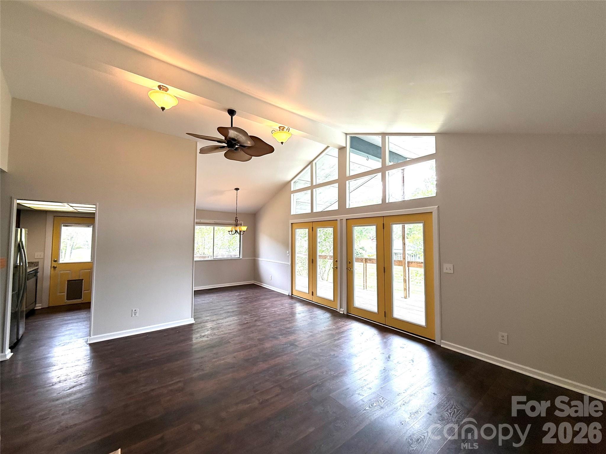 18 Briar Fork Way, Unit 4 Fletcher, NC 28732 - Photo 9 of 36 an empty room with wooden floor and windows