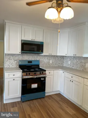 a kitchen with a stove and a sink