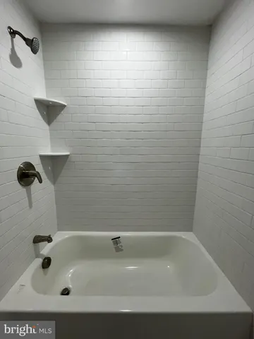 a bathroom with a bath tub