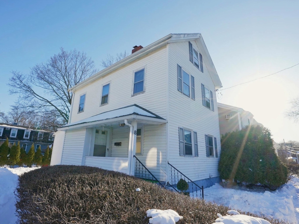 8 Curve Street Newton, MA 02465 - Photo 2 of 6 a front view of a house with garden