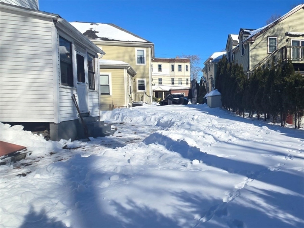 8 Curve Street Newton, MA 02465 - Photo 4 of 6 a view of a house with a yard