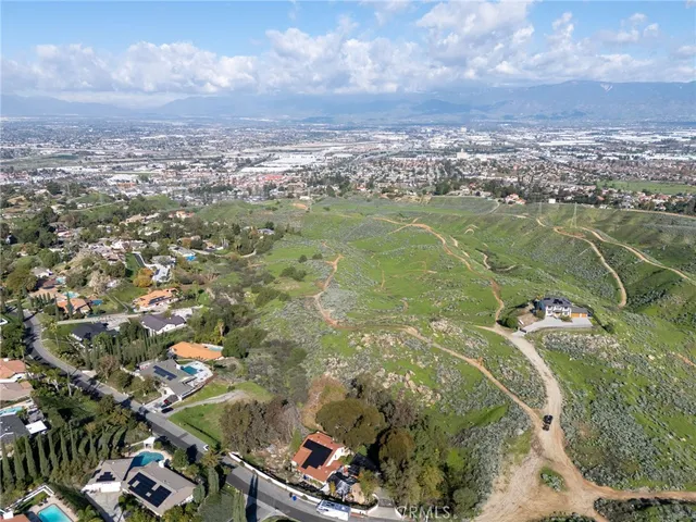 an aerial view of a houses with outdoor space