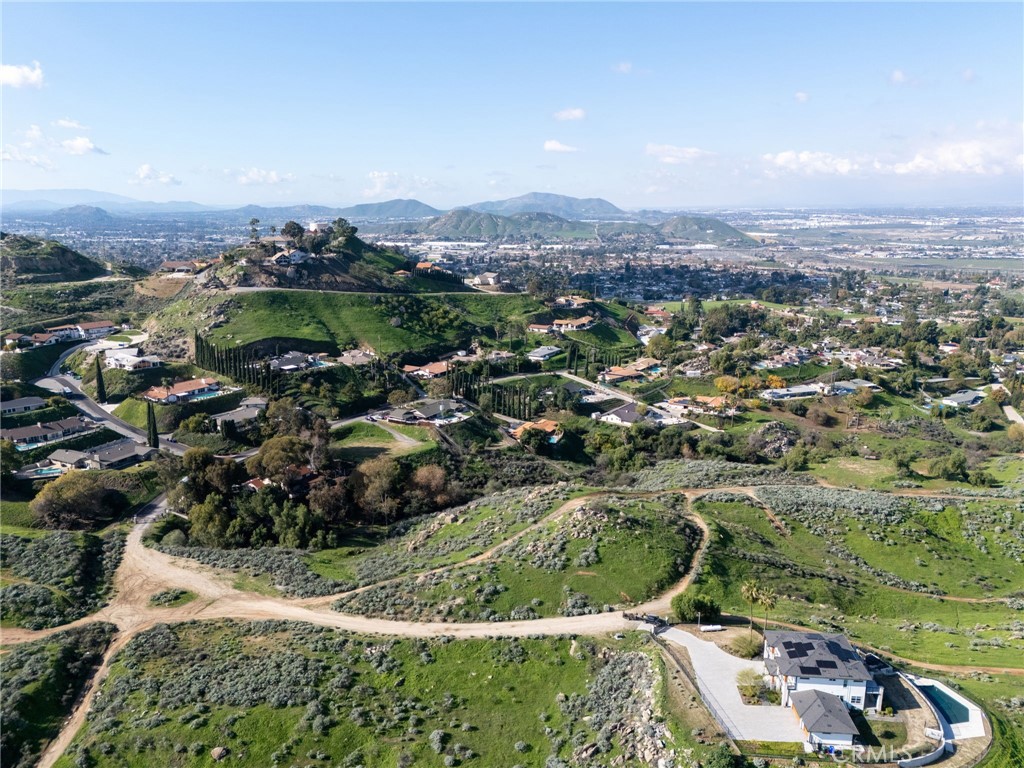 0 Thompson Drive Grand Terrace, CA 92313 - Photo 16 of 16 an aerial view of residential houses with outdoor space and trees
