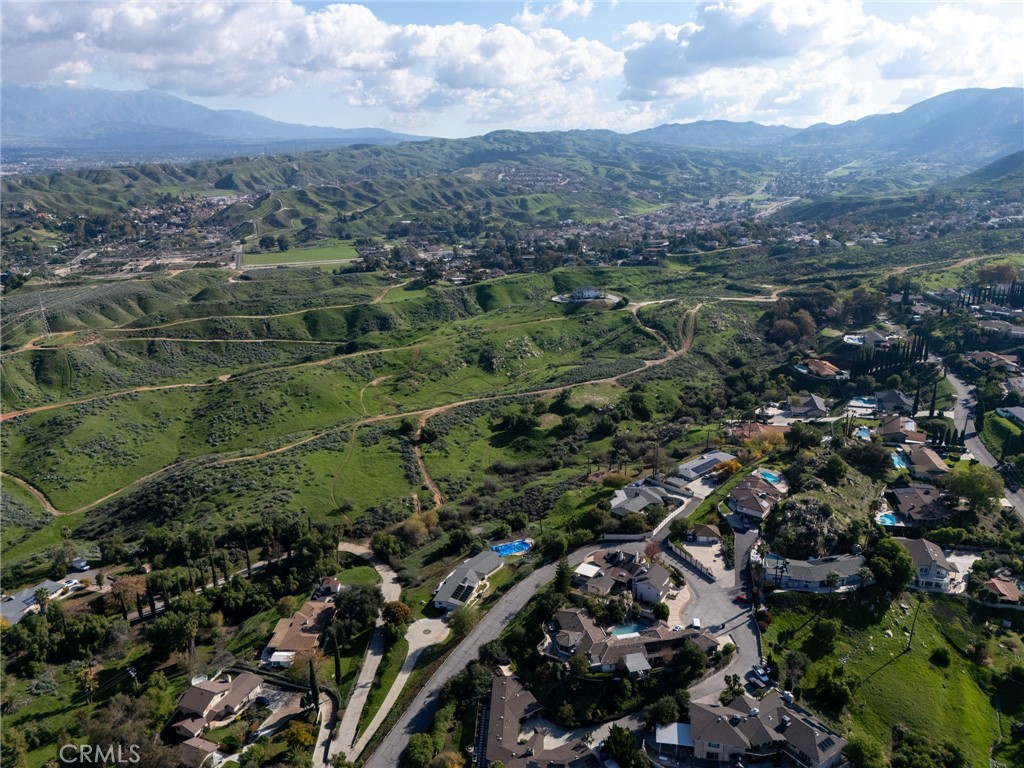 0 Thompson Drive Grand Terrace, CA 92313 - Photo 7 of 16 an aerial view of residential houses with outdoor space and trees