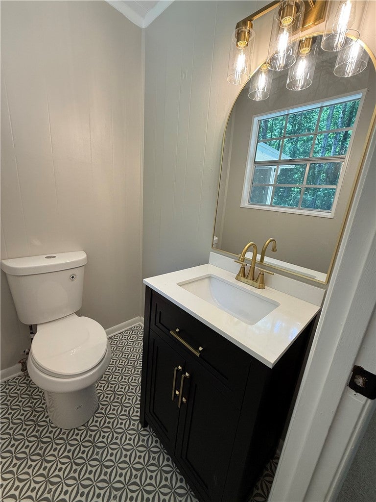 306 Crawford Road Opelika, AL 36804 - Photo 21 of 31 This thoughtfully designed bathroom offers a stylish vanity and unique patterned flooring.