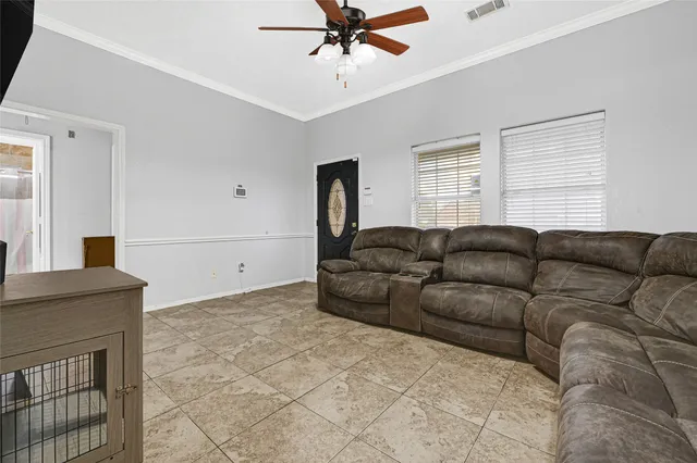 a living room with a couch and a window