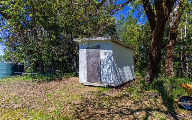 a view of a mountain range with trees in the background