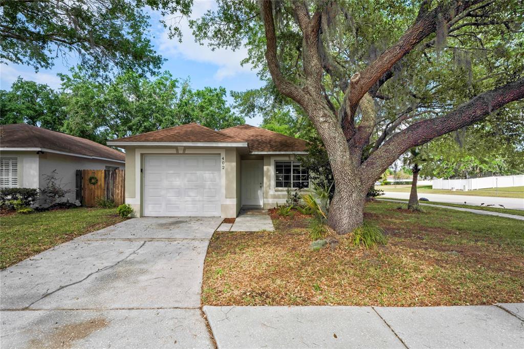 402 Abigail Road Plant City, FL 33563 - Photo 1 of 1 a front view of a house with garden