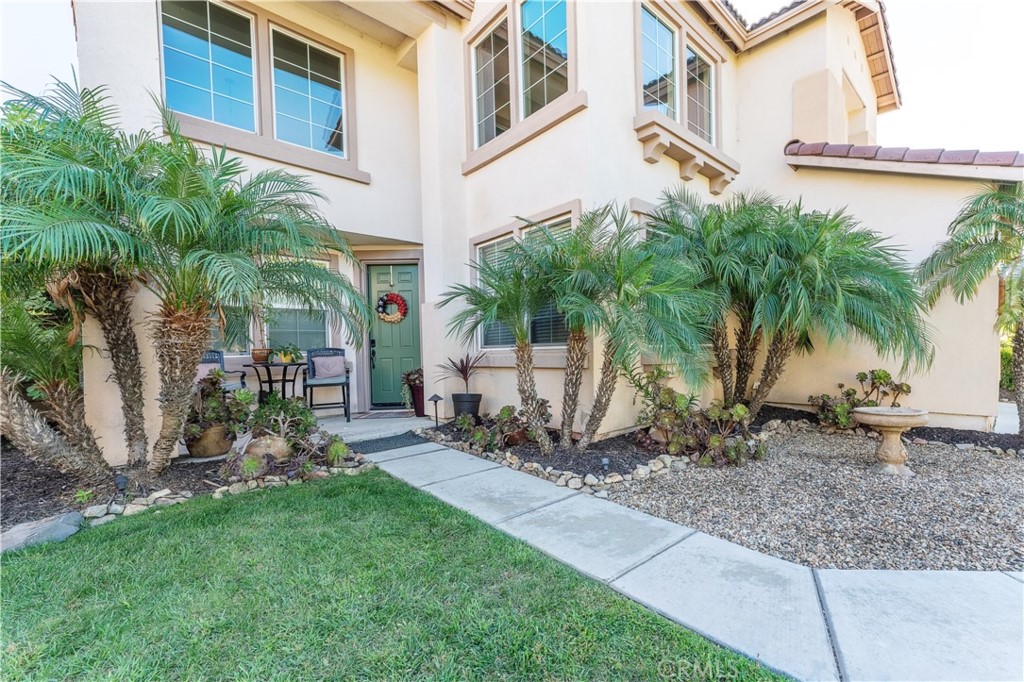27759 Tate Road Menifee, CA 92585 - Photo 1 of 1 a view of a backyard with a garden