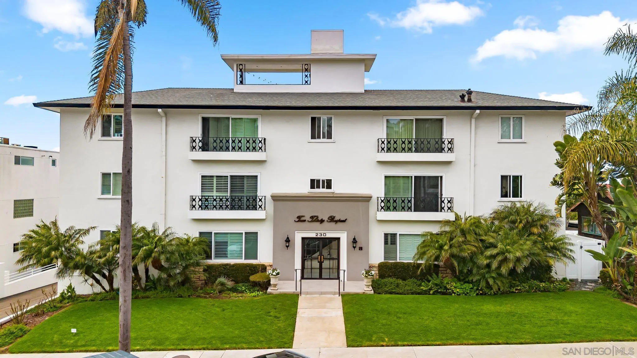 230 Prospect Street, Unit 12 La Jolla, CA 92037 - Photo 1 of 14 a view of a yard in front of a house