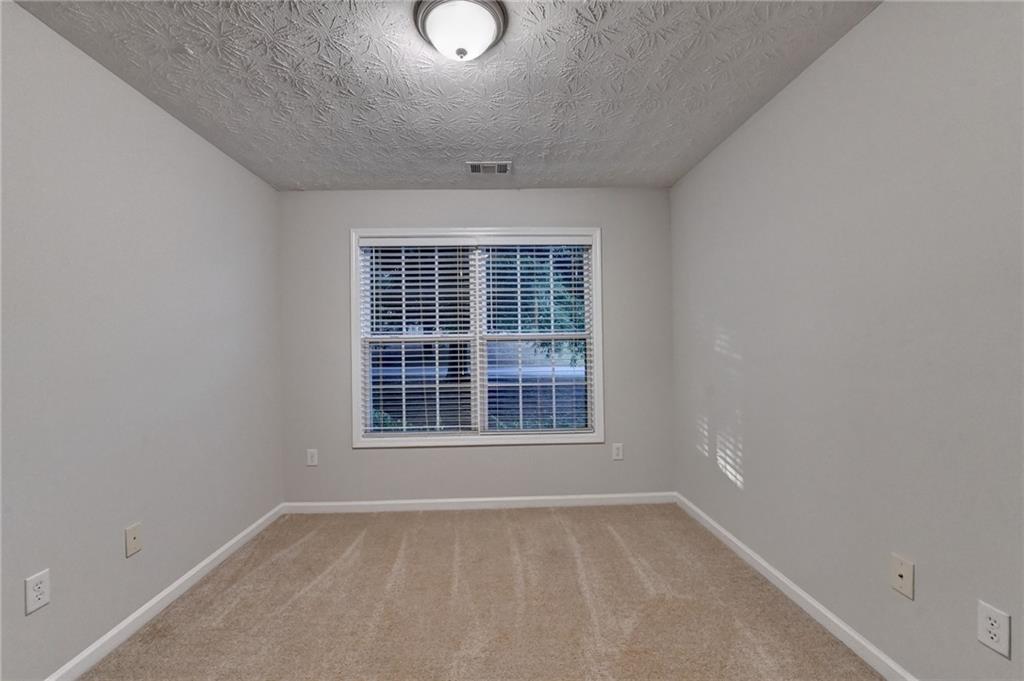 310 Andrew Ridge Drive Jefferson, GA 30549 - Photo 28 of 52 an empty room with a window